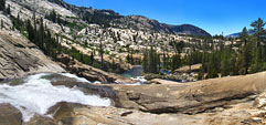 Released from the constraints of the channel, the Tuolumne explodes into a white water torrent and races down the mountain