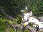 Hikers climb the long series of steps into the misty spray of Vernal Falls