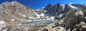 Consultation Lake in the south of the Trail Camp basin. You can make out a hiker, bottom of lake, left of center, standing on the rocks 